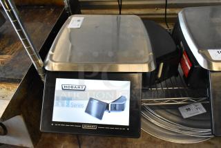 Hobart HT Series food scale, stainless steel, touchscreen interface, excellent condition, auction tag indicating item 99.