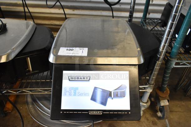 Hobart HT Series commercial scale with digital display, stainless steel platform, good condition, auction tag showing "100 QTY 1".