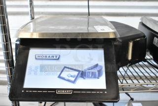 Hobart HT Series commercial scale with touchscreen display, stainless steel weighing platform, in good condition.