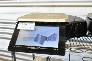 Hobart electronic scale with digital display, model indicated as HT Series. Auction tag 105 attached. Good condition.
