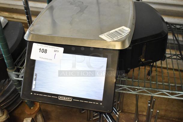 Hobart commercial scale with digital display, stainless steel weighing platform. Auction tag reads "108 QTY 1."