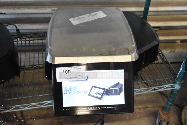 Hobart HT series commercial scale with digital display. Includes auction tag 109. Shows signs of use.
