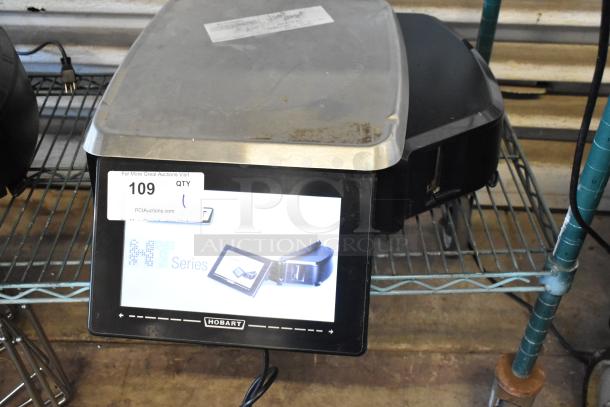 Hobart M Series slicer, stainless steel top, digital display, moderate wear, auction tag 109 visible.