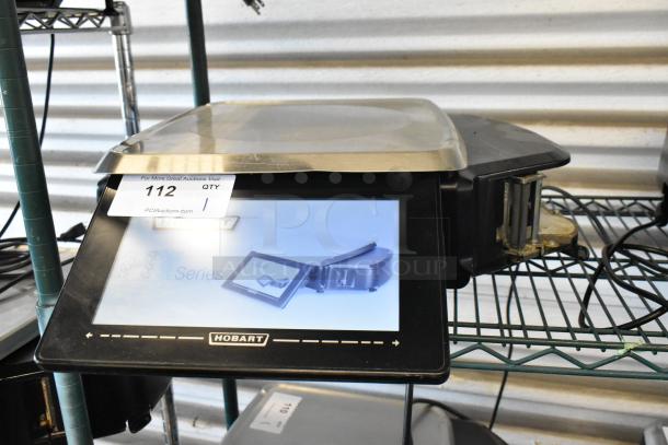 Hobart digital scale with touchscreen display, stainless steel tray. Marked "112 QTY 1" for auction. Good condition.