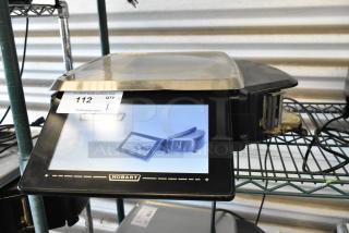 Hobart digital scale with touchscreen display, stainless steel tray. Marked "112 QTY 1" for auction. Good condition.