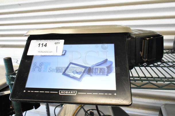 Hobart HT Series touchscreen scale, model with visible auction tag "114". Digital display, lightly used condition.