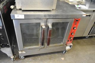 Vulcan Stainless Steel Commercial Full Size Convection Oven w/ View Through Doors, and Thermostatic Controls on Commercial Casters.