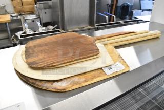 4 Wooden Pizza Peels. 4 Times Your Bid! - Item #1186360