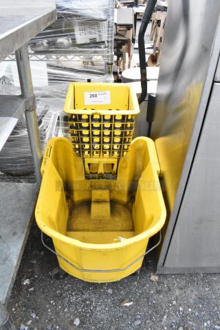 Yellow Poly Mop Bucket w/ Wringing Attachment on Commercial Casters.