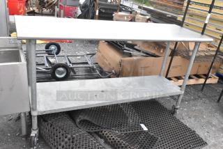 Stainless Steel Table w/ Metal Under Shelf on Commercial Casters.