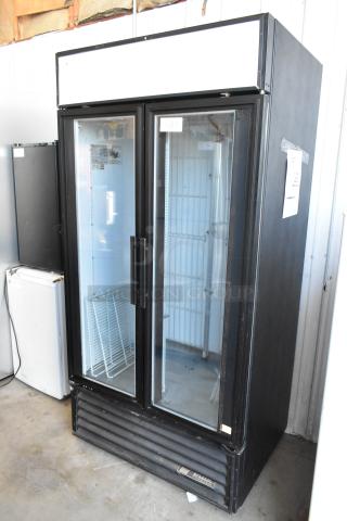 True GDM-35F Metal Commercial 2 Door Reach In Freezer Merchandiser w/ Poly Coated Racks. 115 Volts, 1 Phase.