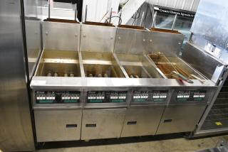 2017 Pitco Frialator SG18 Stainless Steel Commercial Natural Gas Powered 4 Bay Deep Fat Fryer w/ Filtration System and 3 Metal Fry Baskets on Commercial Casters. 140,000 BTU.