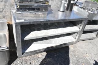 Stainless Steel Table w/ 2 Metal Under Shelves.