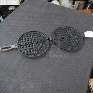 One Cast Iron Waffle Maker.