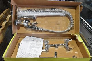 BRAND NEW SCRATCH AND DENT! Equip by T&S 5PR-8W12 Wall Mounted 35 3/4" High Pre-Rinse Faucet with 8" Adjustable Centers, 44" Hose, 12 1/8" Add-On Faucet, and 6" Wall Bracket