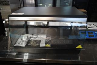 BRAND NEW SCRATCH AND DENT! Avantco 177OAM1A 26" Black Countertop Merchandiser with LED Lighting and 1 Shelf. 120 Volts, 1 Phase.