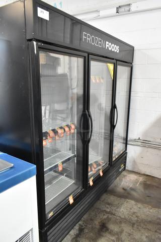 2017 True GDM-72F-HC Metal Commercial 3 Door Reach In Freezer Merchandiser w/ Poly Coated Racks. 115/208-230 Volts, 1 Phase.