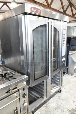Baxter OV310G Stainless Steel Commercial Natural Gas Powered Mini Rotating Pan Rack Oven w/ Lower Pan Rack on Commercial Casters.