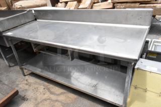 Stainless Steel Table w/ Back Splash and Under Shelf.