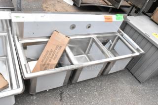 BRAND NEW SCRATCH AND DENT! Regency 600S31515 54" 16-Gauge Stainless Steel Three Compartment Commercial Sink with Galvanized Steel Legs and without Drainboards - 15" x 15" x 12" Bowls. No Legs.