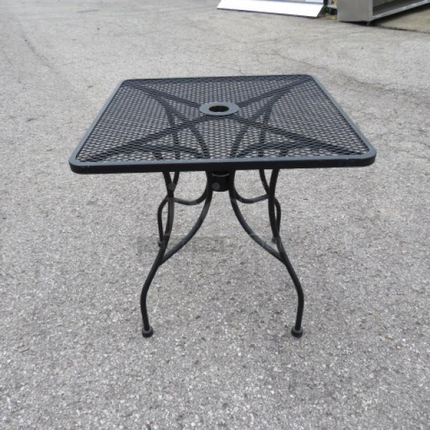One Black Metal Patio Table With Umbrella Hold.  30X30X30 - Image 1 of 1