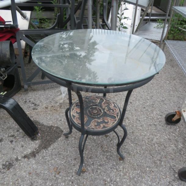 One Black Metal Table With A Glass Top. 24X29 - Image 1 of 1