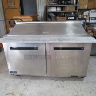 One WORKING Artic Air 2 Door Refrigerated Prep Table With Cutting Board And 2 Racks On Casters. Model# AMT60R. 115 Volt. 62X36X47. $3599.00 - Item #1190243