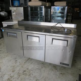One True 3 Door Worktop Refrigerator On Casters. 115 Volt. Model# TWT-72. 71X31X37. WORKING NOT COLD. $4724.00 - Item #1190250