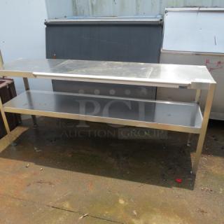 One Stainless Steel Over Shelf With 2 SS Shelves And A San Jamar 48 Inch Ticket Rail. 72X20X32