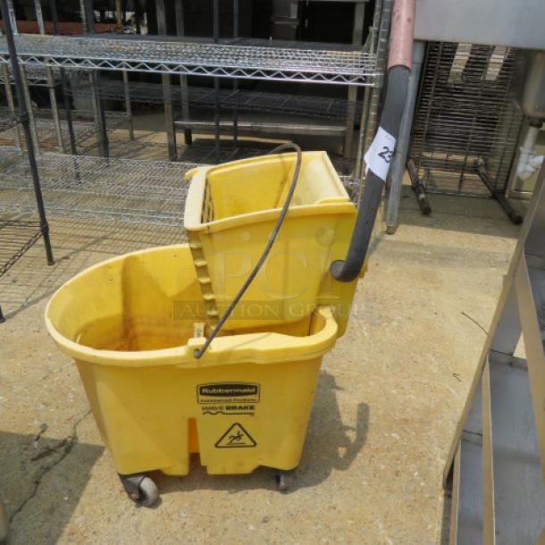 One Rubbermaid Mop Bucket And Wringer. - Image 1 of 1