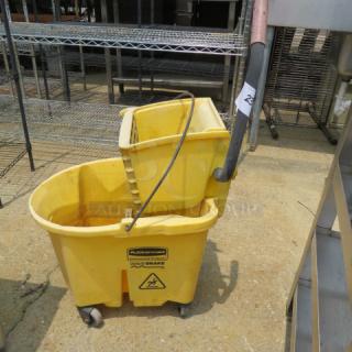 One Rubbermaid Mop Bucket And Wringer.