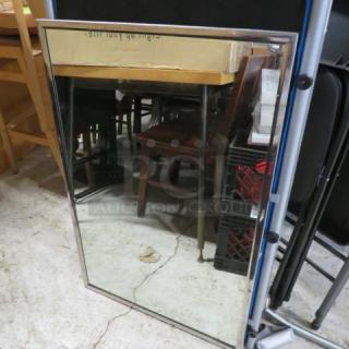 One Stainless Steel Framed Mirror. 36X24