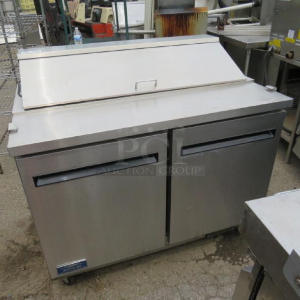 One Artic Air 2 Door Refrigerated Prep Table With 2 Racks On Casters.  Model# AST48RZ. 115 Volt. Working NOT COLD. 49X30X44 - Image 1 of 3
