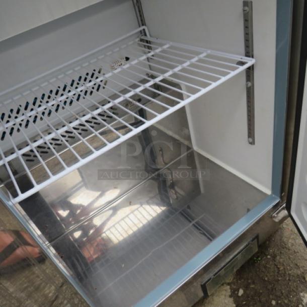 One Artic Air 2 Door Refrigerated Prep Table With 2 Racks On Casters.  Model# AST48RZ. 115 Volt. Working NOT COLD. 49X30X44 - Image 3 of 3
