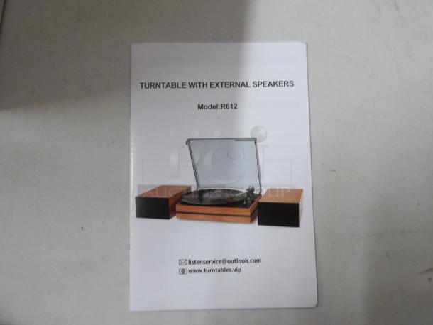 Turntable with External Speakers, Model# R612, normal Speeds, 12V
Brand New in Box, color walnut red - Image 2 of 4