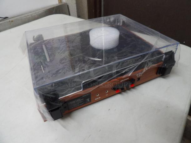 Turntable with External Speakers, Model# R612, normal Speeds, 12V
Brand New in Box, color walnut red - Image 3 of 4