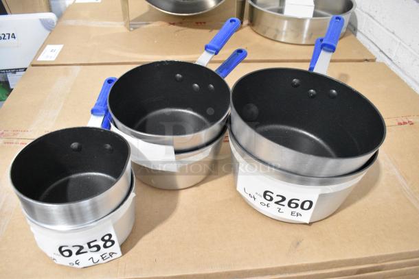 6 BRAND NEW SCRATCH AND DENT! Items Including 2 Vollrath Z434112 Wear-Ever 1.5 Qt. Tapered Non-Stick Aluminum Sauce Pan with SteelCoat x3 and Blue Silicone Cool Handle, 2 Vollrath Z434212 Wear-Ever 2.75 Qt. Tapered Non-Stick Aluminum Sauce Pan with SteelCoat x3 and Blue Silicone Cool Handle, 2 Vollrath Z434412 Wear-Ever 4.5 Qt. Tapered Non-Stick Aluminum Sauce Pan with SteelCoat x3 and Blue Silicone Cool Handle. 6 Times Your Bid! - Image 1 of 9