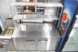 Universal Coolers SC-60-LBI Stainless Steel Commercial 2 Door Work Top Cooler w/ 2 Tier Over Shelf on Commercial Casters. 115 Volts, 1 Phase. Tested and Working!