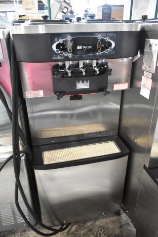Taylor C713-33 Stainless Steel Commercial Floor Style Air Cooled 2 Flavor w/ Twist Soft Serve Ice Cream Machine on Commercial Casters. 208-230 Volts, 3 Phase. - Item #1187324