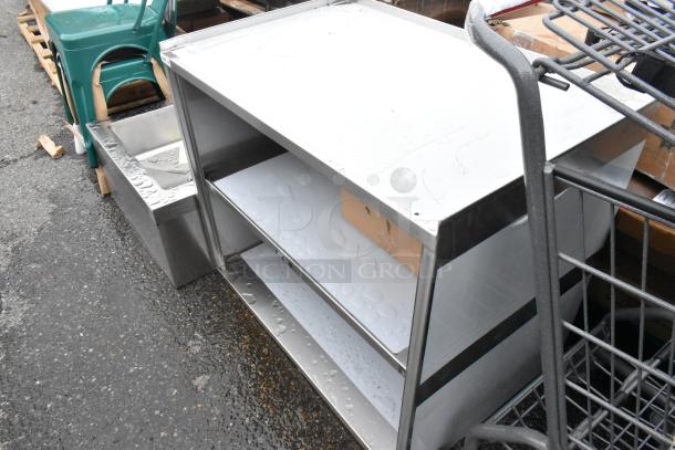 BRAND NEW SCRATCH AND DENT! Regency 600CT3S2133E 21" x 33" Three Shelf 18-Gauge 304 Stainless Steel Utility Cart with Enclosed Base and Open Front - Image 3 of 5