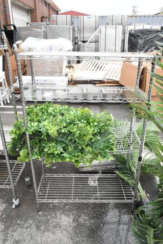 Chrome Finish 4 Tier Wire Shelving Unit w/ Contents Including Fake Plant. BUYER MUST DISMANTLE. PCI CANNOT DISMANTLE FOR SHIPPING. PLEASE CONSIDER FREIGHT CHARGES.