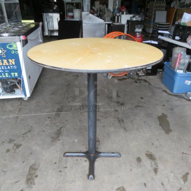 One Light Oak Laminate Tabletop On A Bar Height Pedestal Base. 36X36X41 - Image 1 of 1