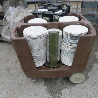 One Winco Portable Plate Cart On Casters Filled With Assorted Plates.