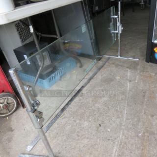 One Stand Alone Glass/Chrome Sneeze Guard. 53X18X23