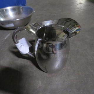 One Stainless Steel Water Pitcher.