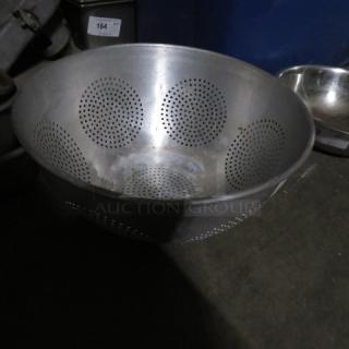 One Aluminum Colander.