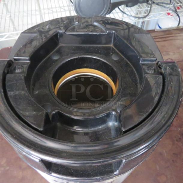 Vacuum cleaner base, black plastic, used condition, visible dust, no labels or markings. Suitable for parts or repair.
