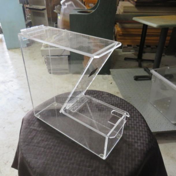 Clear acrylic display case, Z-shaped, in excellent condition, showing side panel and top access door. Ideal for showcasing items.