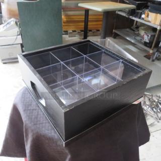 Wooden display box with nine acrylic compartments, glass top, used condition. Ideal for collectibles or retail display.