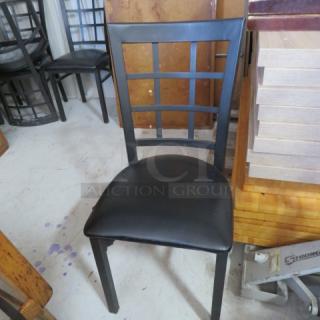 Black Metal Chair With A Black Cushioned Seat. 7XBID - Item #1191997
